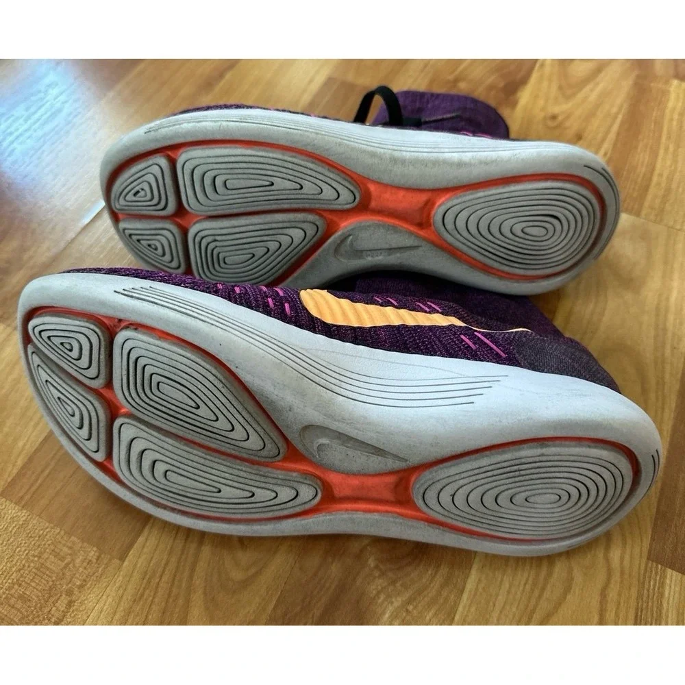 Nike LunarEpic Flyknit running shoes in a purple colorway with an orange swoosh.